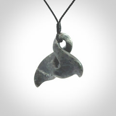 This whale tail twist pendant, is carved from a very striking New Zealand Nelson jade.