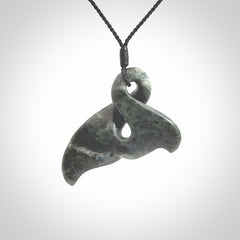 This whale tail twist pendant, is carved from a very striking New Zealand Nelson jade.