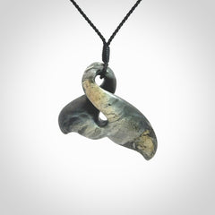 This whale tail twist pendant, is carved from a very striking New Zealand Nelson jade.