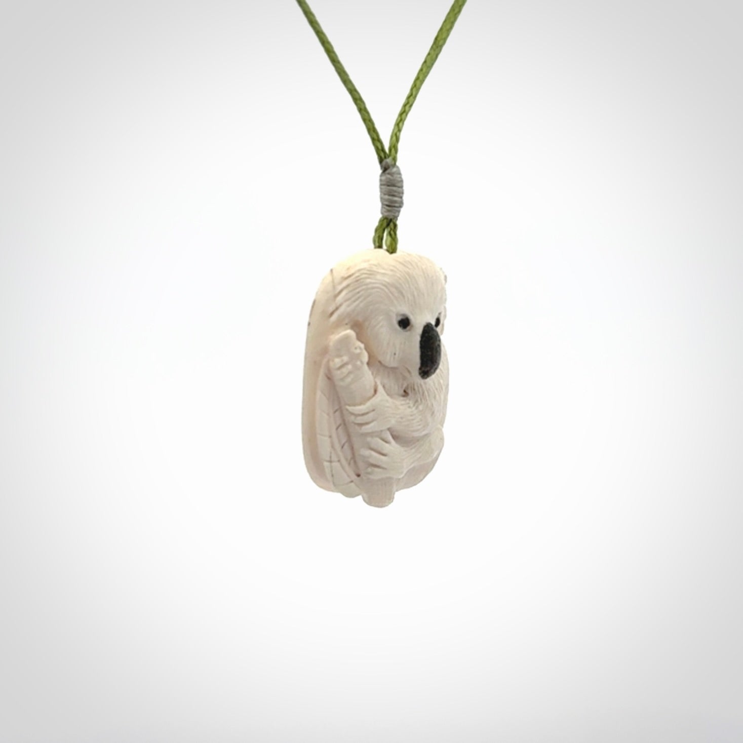 Hand carved woolly mammoth tusk koala bear pendant