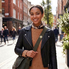 Woman wearing bone pin on her bag