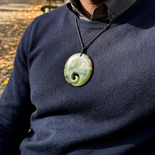 Man wearing Jade koru pendant