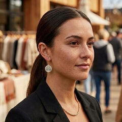Woman wearing bone earrings