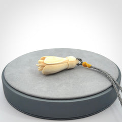 Hand carved Kowhai flower. These are made from Woolly Mammoth tusk and are a soft golden colour. They are provided with a hand plaited, adjustable cord. Shipping is free worldwide.