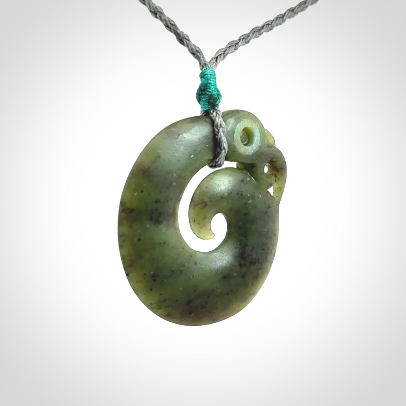 New Zealand Koru Manaia. Hand carved Koropepe pendant. Made in New Zealand. Real Jade, pounamu.