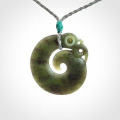 New Zealand Koru Manaia. Hand carved Koropepe pendant. Made in New Zealand. Real Jade, pounamu.