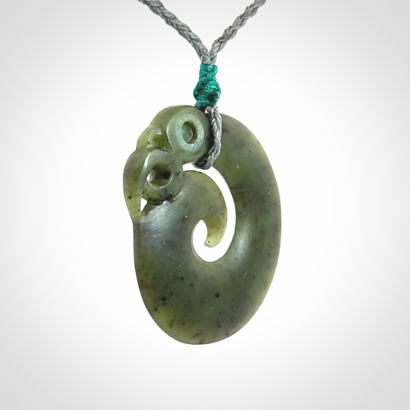 New Zealand Koru Manaia. Hand carved Koropepe pendant. Made in New Zealand. Real Jade, pounamu.