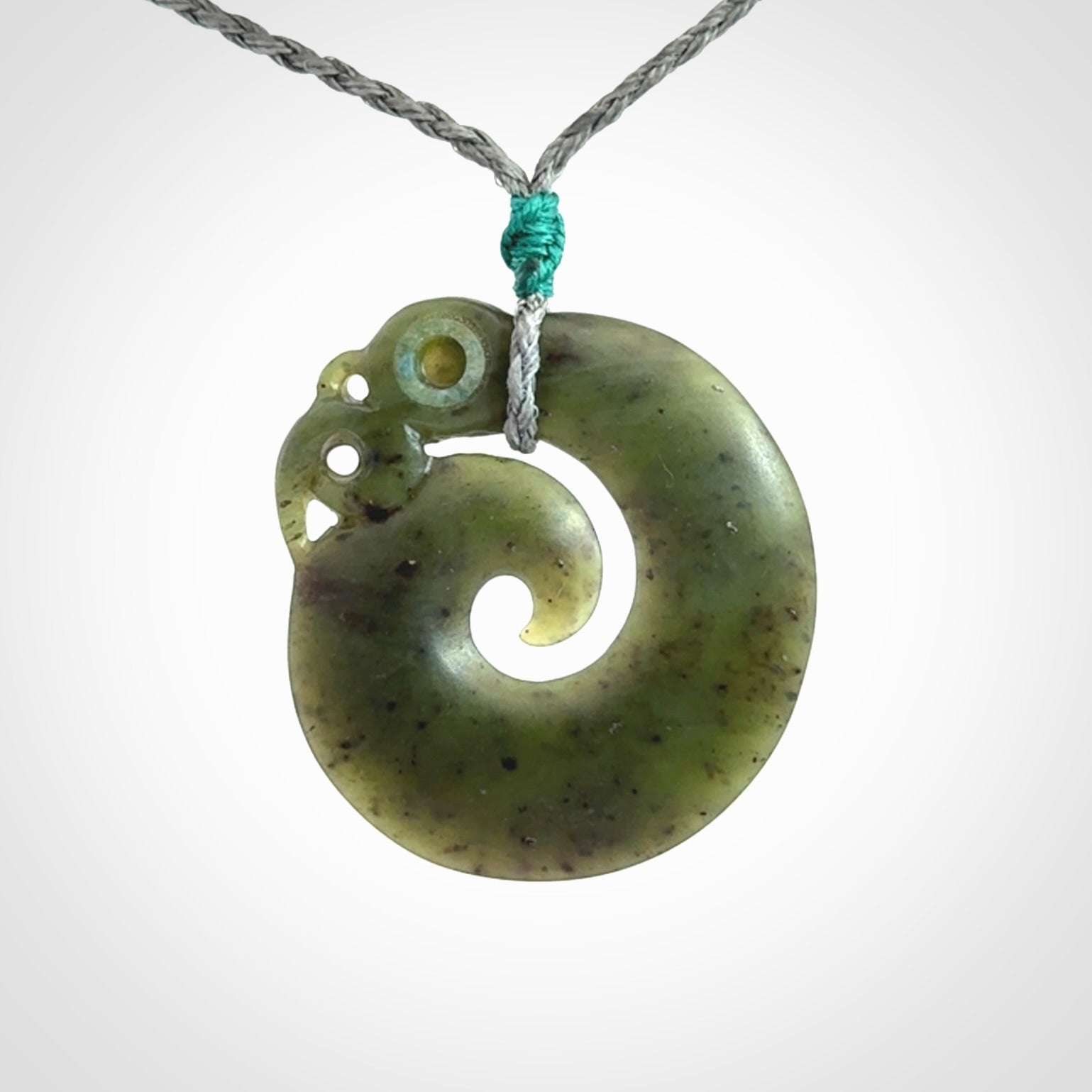 New Zealand Koru Manaia. Hand carved Koropepe pendant. Made in New Zealand. Real Jade, pounamu.