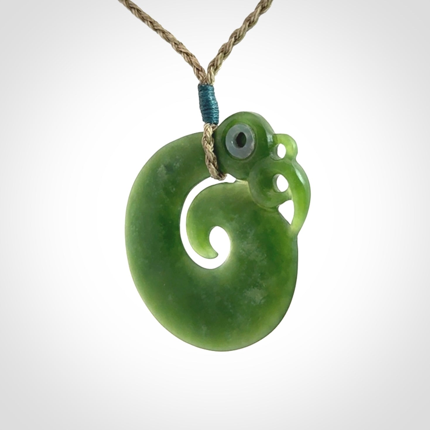 New Zealand Koru Manaia. Hand carved koropepe pendant. Made in New Zealand. Real Jade, pounamu.