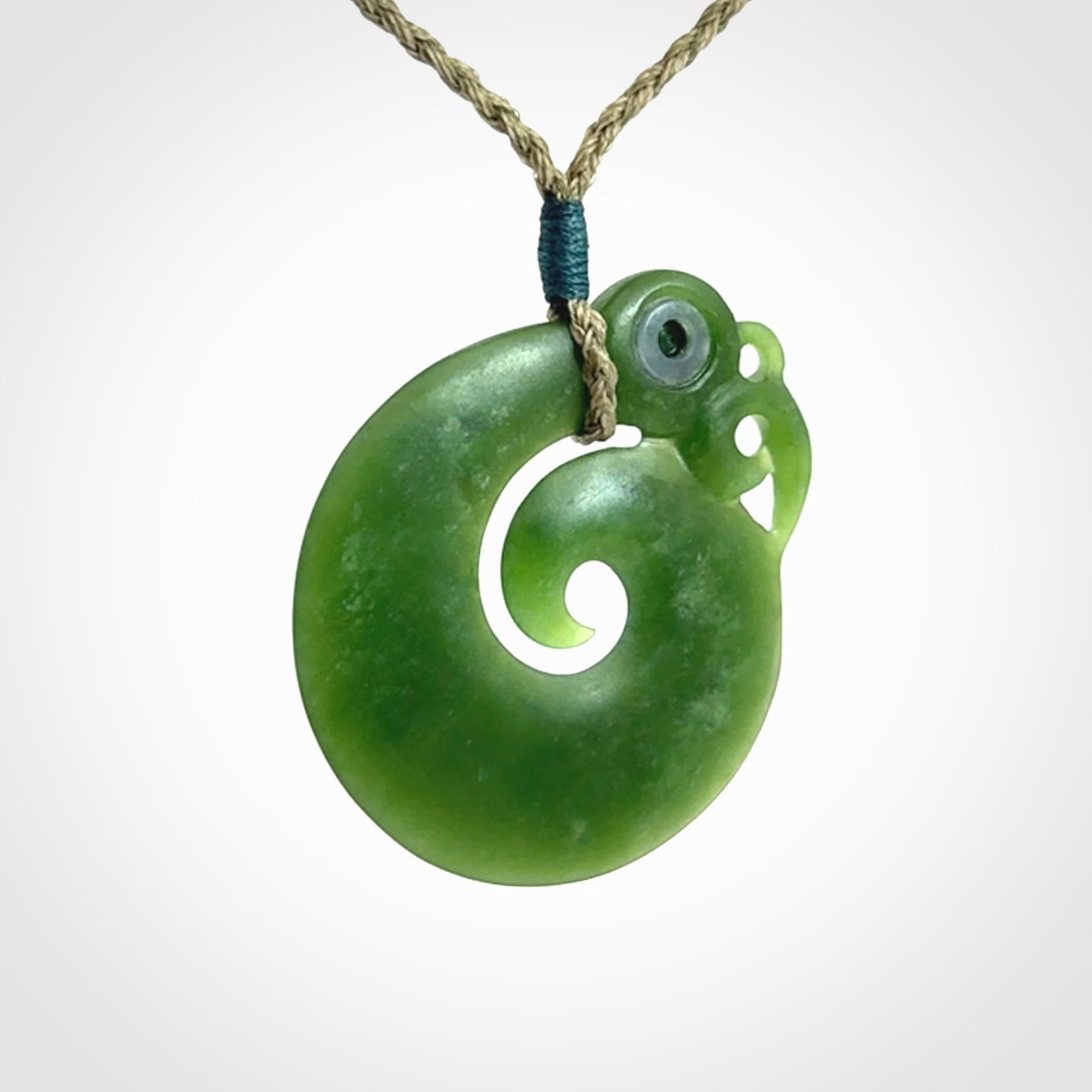 New Zealand Koru Manaia. Hand carved koropepe pendant. Made in New Zealand. Real Jade, pounamu.