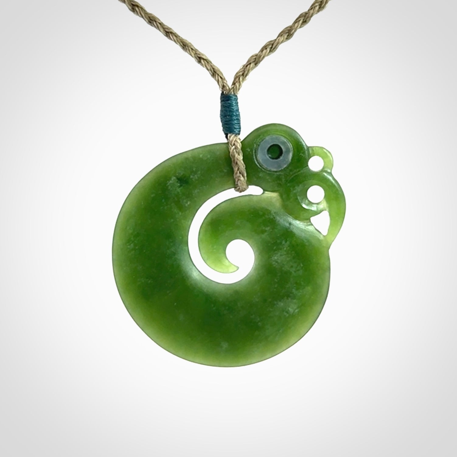 New Zealand Koru Manaia. Hand carved koropepe pendant. Made in New Zealand. Real Jade, pounamu.