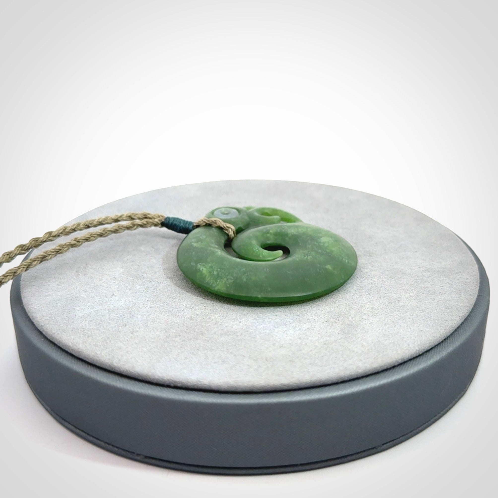 New Zealand Koru Manaia. Hand carved koropepe pendant. Made in New Zealand. Real Jade, pounamu.
