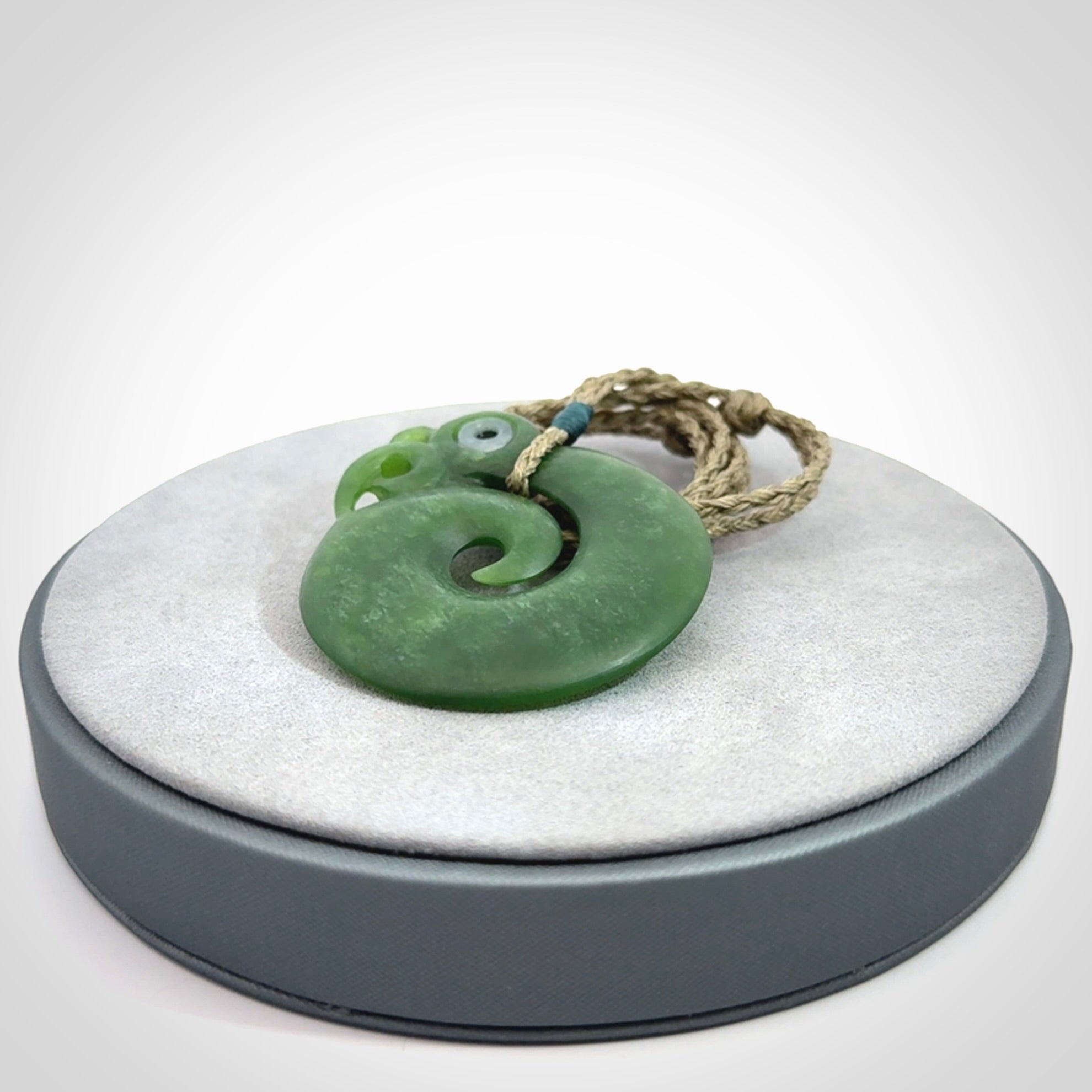 New Zealand Koru Manaia. Hand carved koropepe pendant. Made in New Zealand. Real Jade, pounamu.