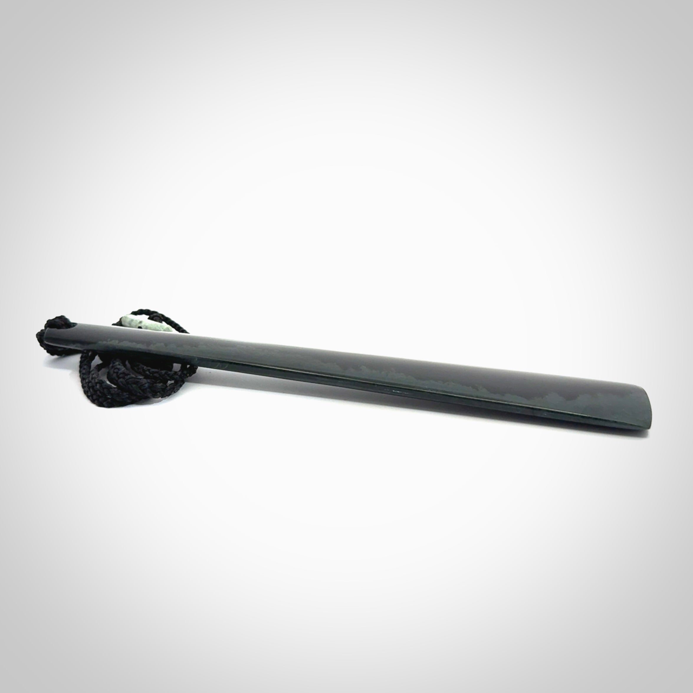 A hand carved large Black Jade drop, roimata, necklace. The cord is a black colour and is a fixed length. A large sized hand made drop necklace by New Zealand artist Kerry Thompson. One off work of art to wear.