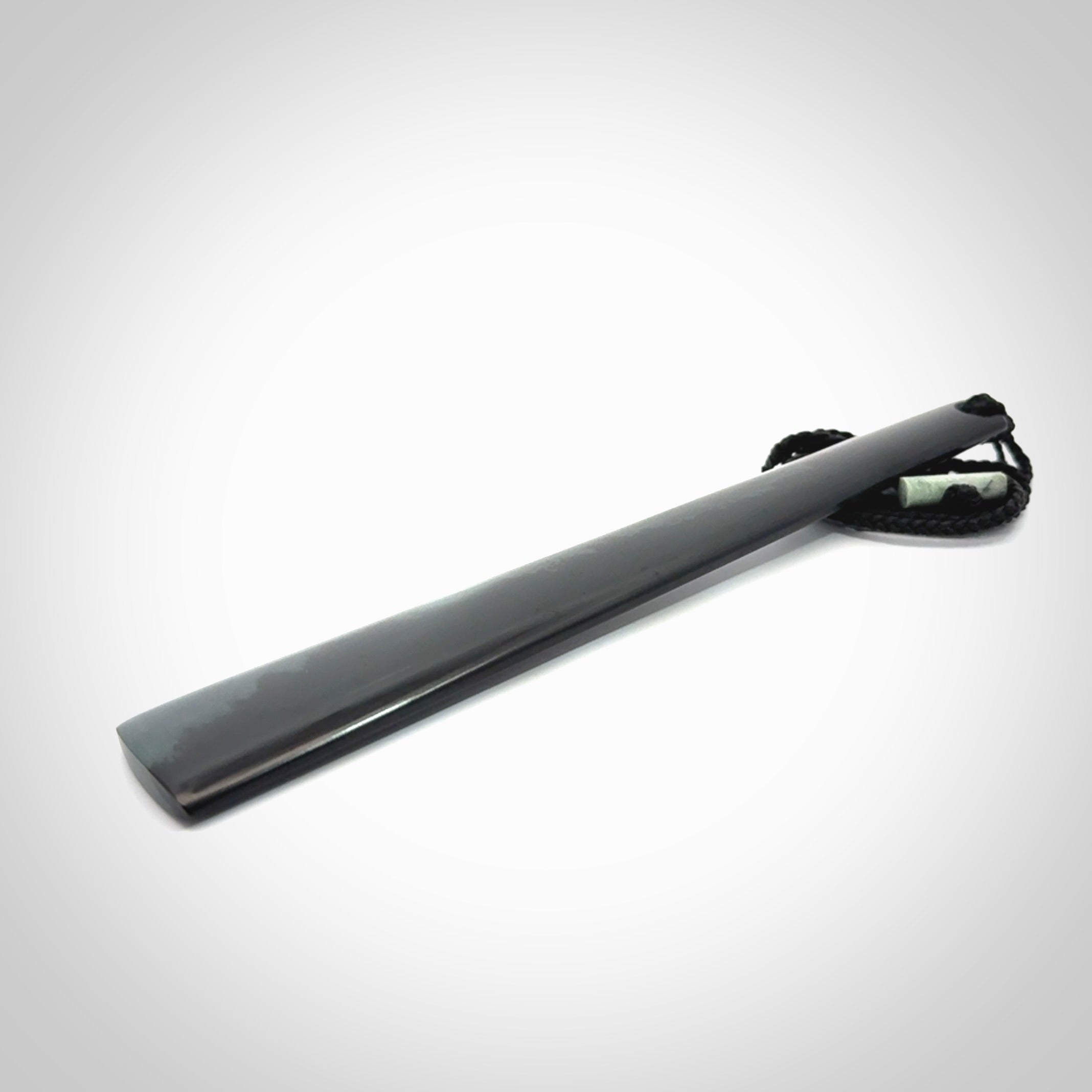 A hand carved large Black Jade drop, roimata, necklace. The cord is a black colour and is a fixed length. A large sized hand made drop necklace by New Zealand artist Kerry Thompson. One off work of art to wear.