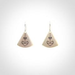 Hand carved New Zealand mother of pearl drop, Koru earrings hand made by Kerry and Amanda Thompson. One only large Koru earrings. Real New Zealand Mother of Pearl art to wear. Free Shipping worldwide.
