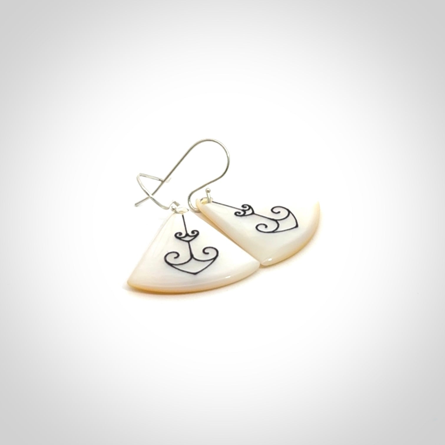 Hand carved New Zealand mother of pearl drop, Koru earrings hand made by Kerry and Amanda Thompson. One only large Koru earrings. Real New Zealand Mother of Pearl art to wear. Free Shipping worldwide.