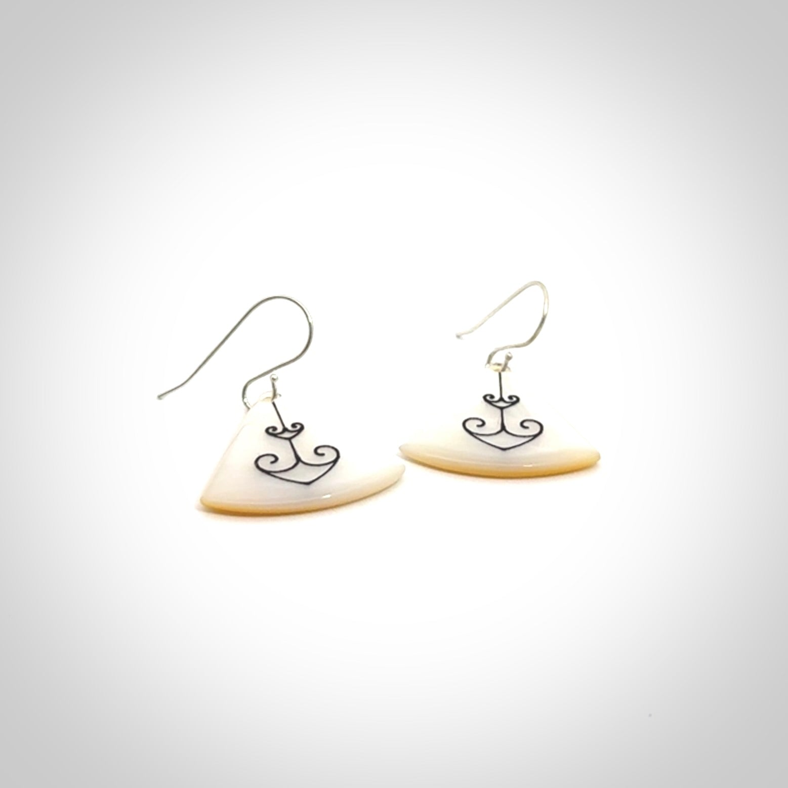 Hand carved New Zealand mother of pearl drop, Koru earrings hand made by Kerry and Amanda Thompson. One only large Koru earrings. Real New Zealand Mother of Pearl art to wear. Free Shipping worldwide.