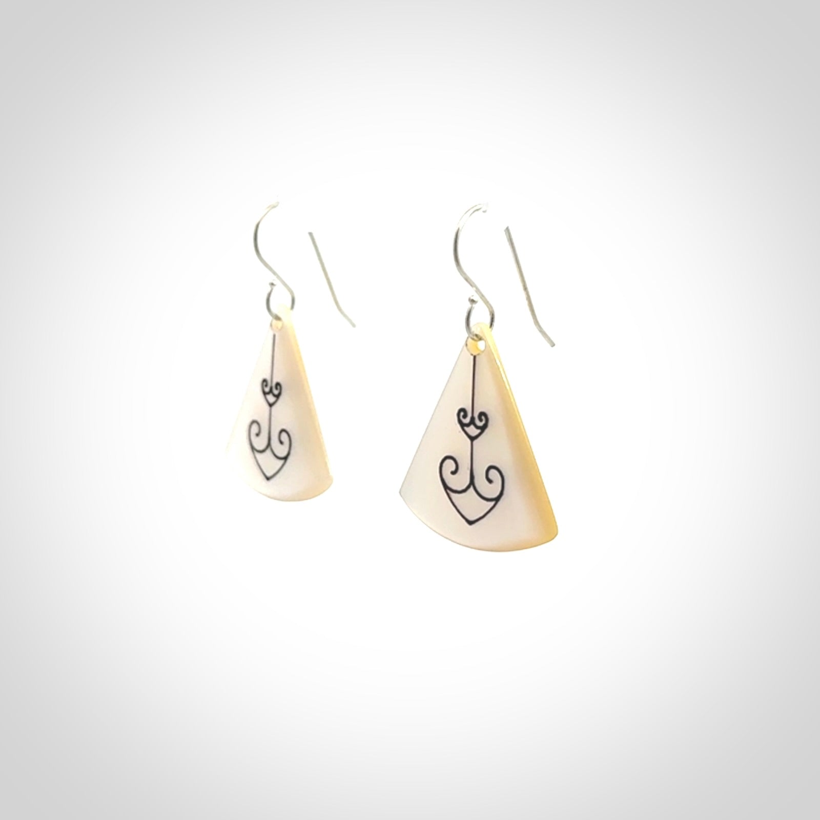 Hand carved New Zealand mother of pearl drop, Koru earrings hand made by Kerry and Amanda Thompson. One only large Koru earrings. Real New Zealand Mother of Pearl art to wear. Free Shipping worldwide.