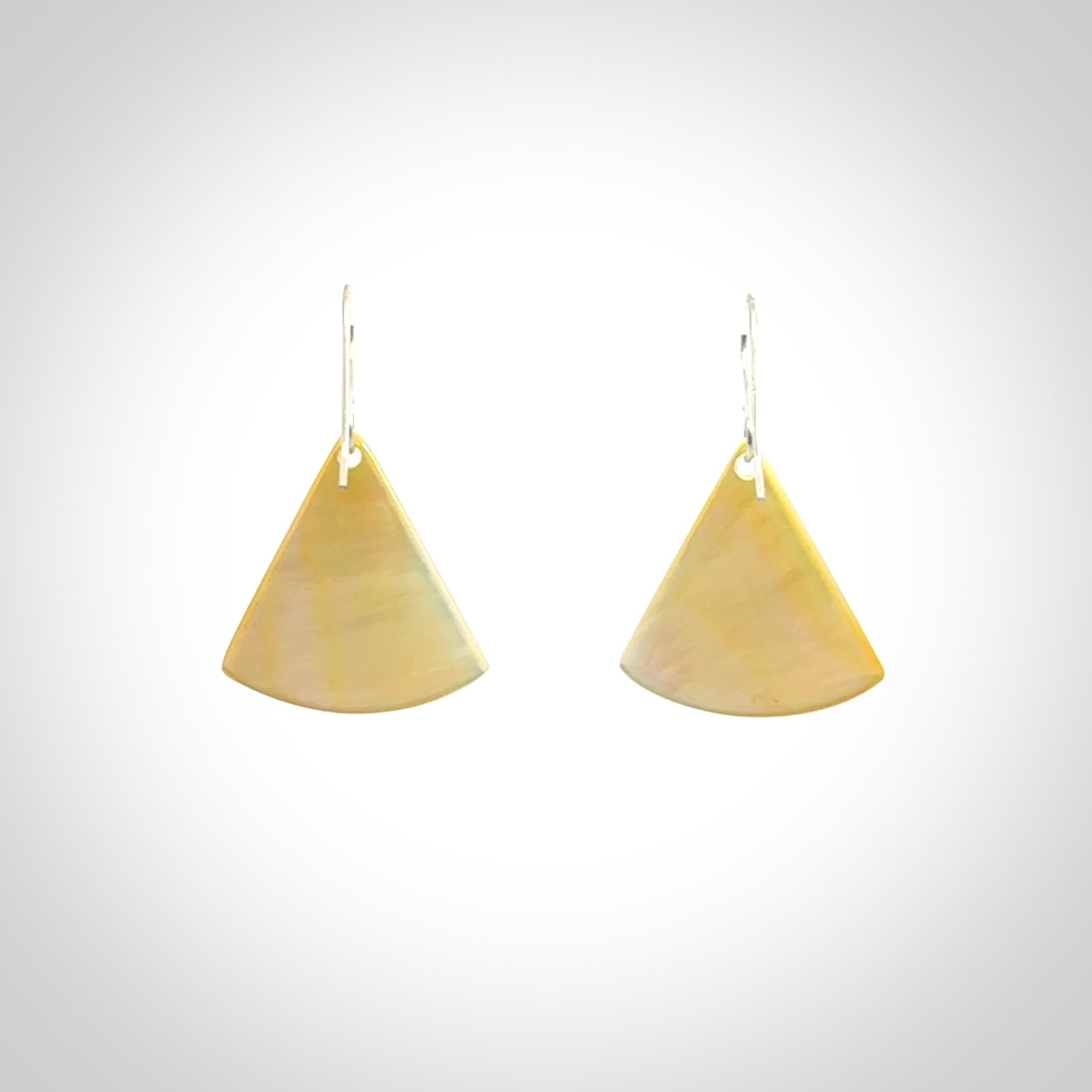 Hand carved New Zealand mother of pearl drop, Koru earrings hand made by Kerry and Amanda Thompson. One only large Koru earrings. Real New Zealand Mother of Pearl art to wear. Free Shipping worldwide.