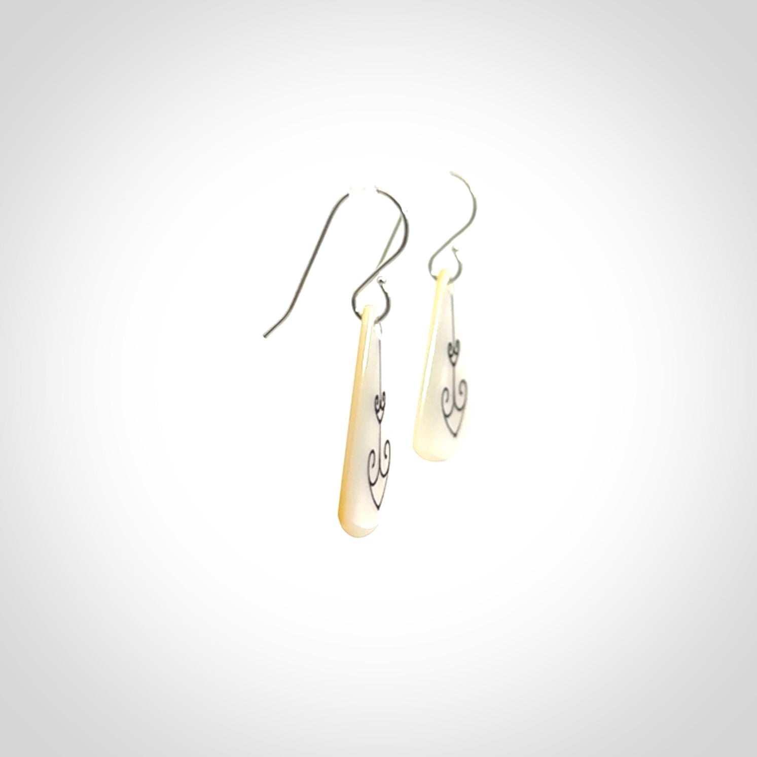 Hand carved New Zealand mother of pearl drop, Koru earrings hand made by Kerry and Amanda Thompson. One only large Koru earrings. Real New Zealand Mother of Pearl art to wear. Free Shipping worldwide.