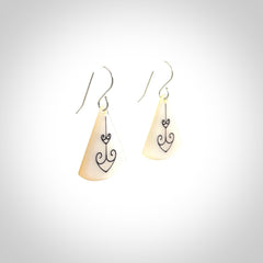 Hand carved New Zealand mother of pearl drop, Koru earrings hand made by Kerry and Amanda Thompson. One only large Koru earrings. Real New Zealand Mother of Pearl art to wear. Free Shipping worldwide.