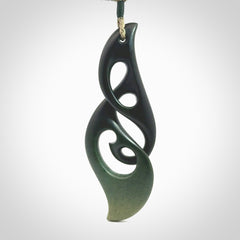 Hand carved New Zealand jade, complex twist drop pendant. Hand made complex twist pendant hand carved in New Zealand. Made by NZ Pacific, jade jewellery for sale online. One only hand made by Kerry Thompson.