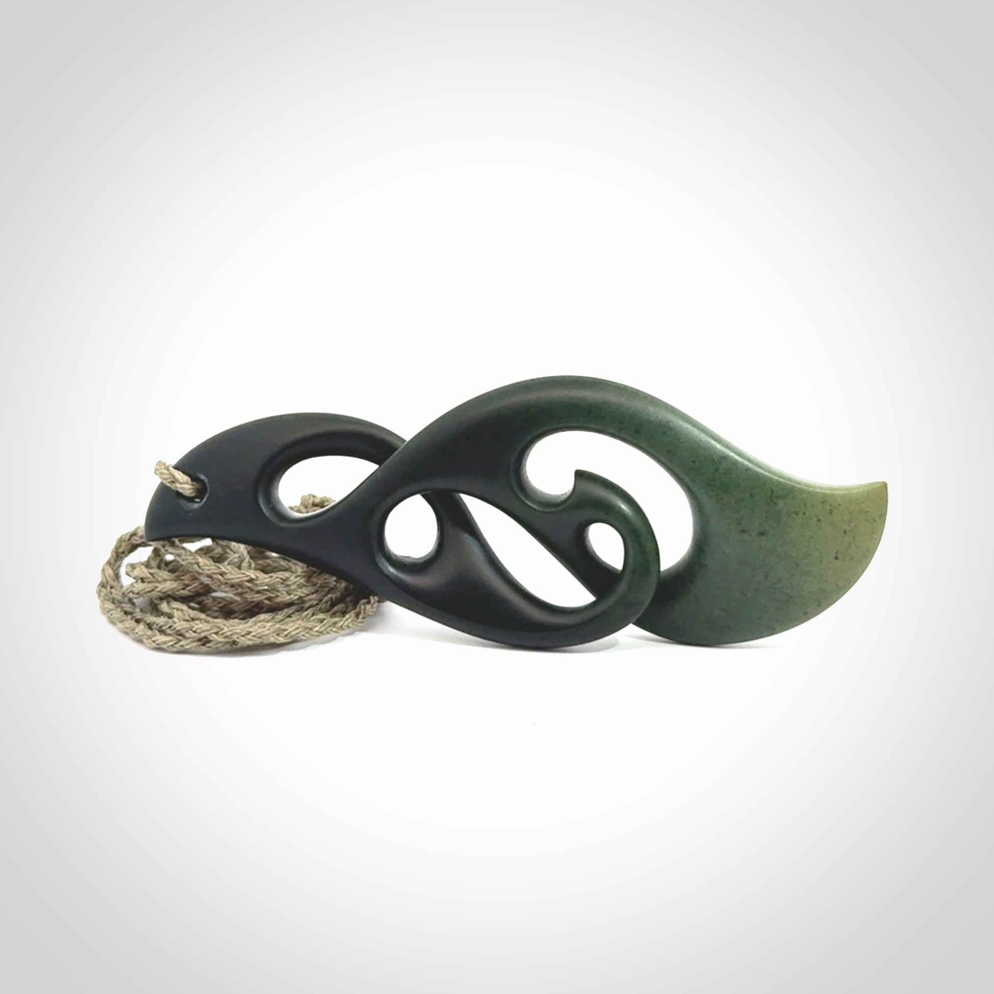 Hand carved New Zealand jade, complex twist drop pendant. Hand made complex twist pendant hand carved in New Zealand. Made by NZ Pacific, jade jewellery for sale online. One only hand made by Kerry Thompson.
