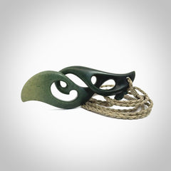 A hand carved twist pendant from New Zealand Jade. The cord is a khaki green colour and is adjustable.