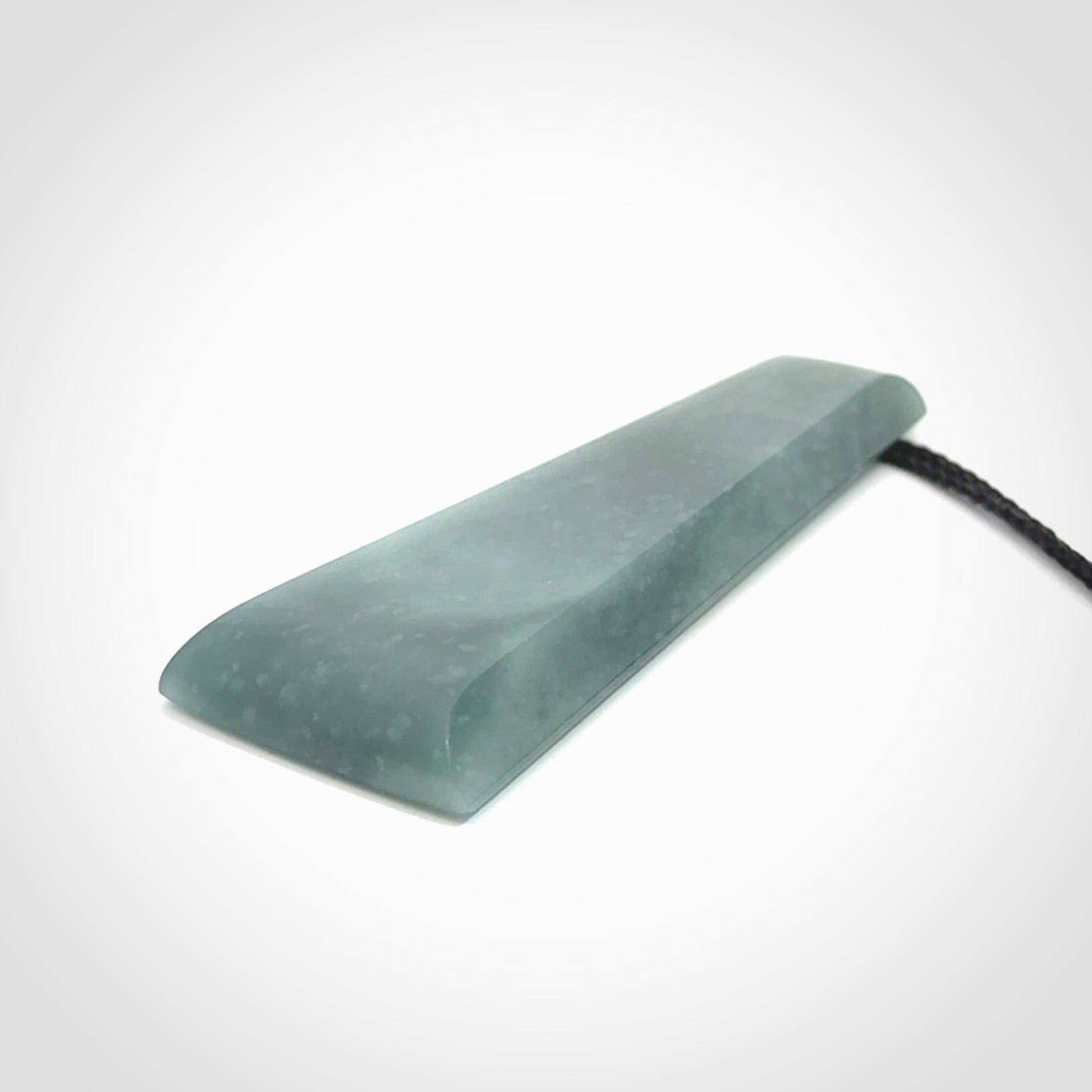 Hand carved large Guatemalan Jadeite Toki pendant.