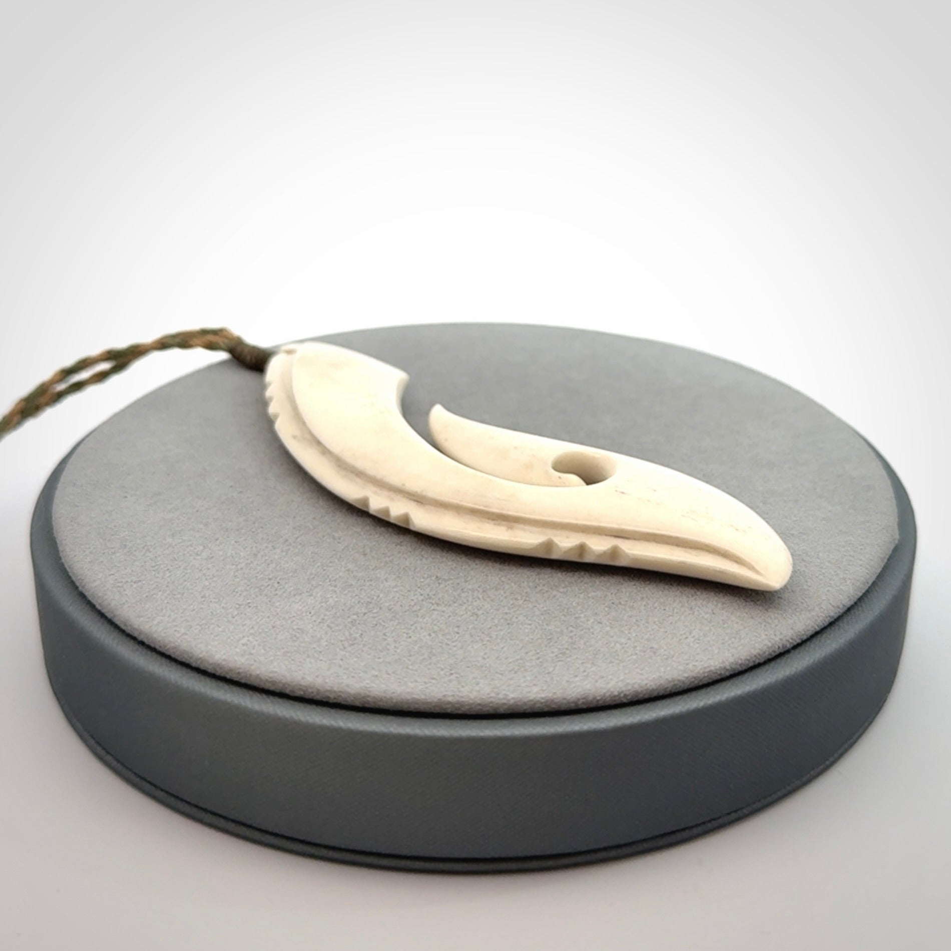 Hand carved large bone hook pendant