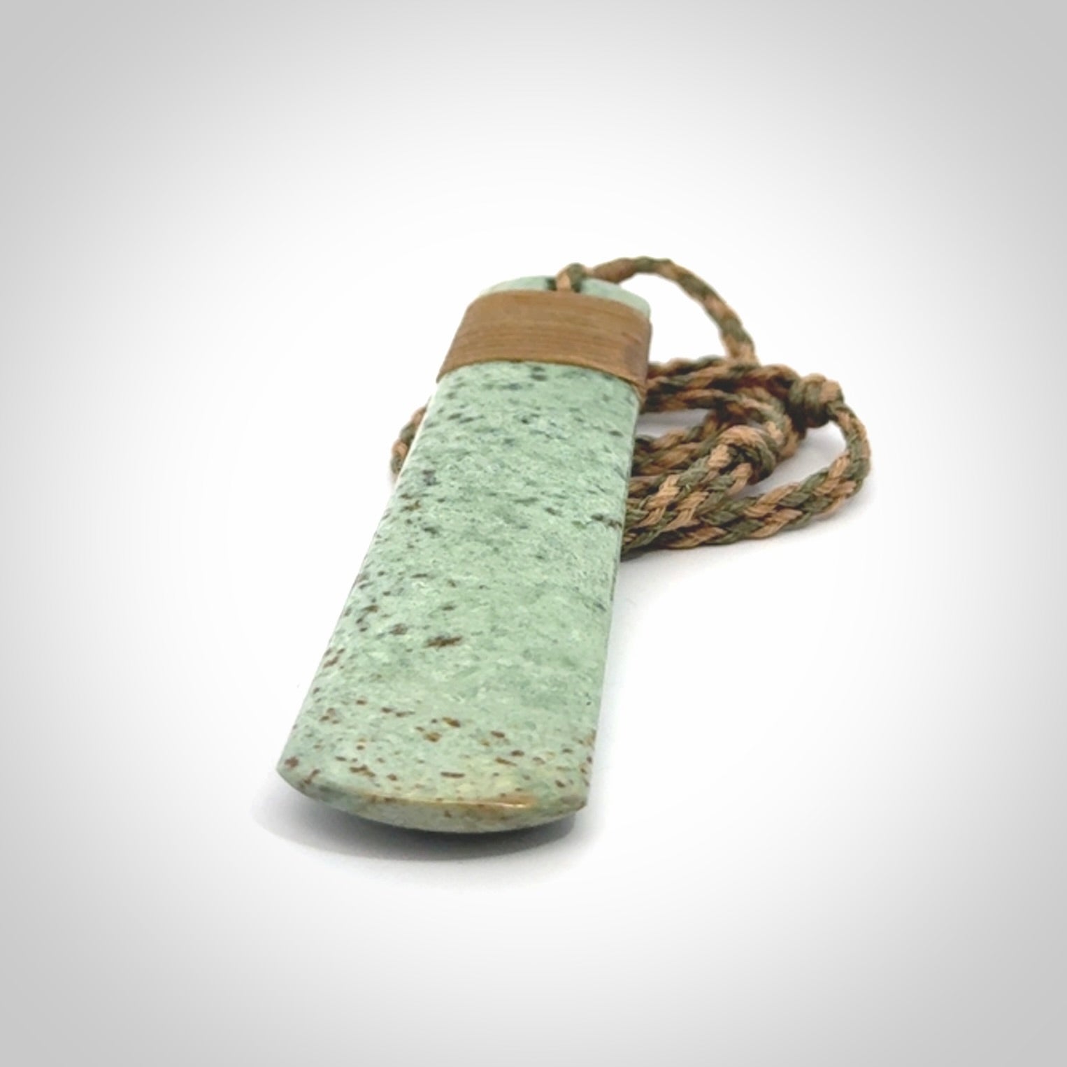 A hand carved large New Zealand Jade drop, roimata, necklace. The cord is a khaki/tan colour and is adjustable. A large sized hand made drop necklace by New Zealand artist Kerry Thompson. One off work of art to wear.