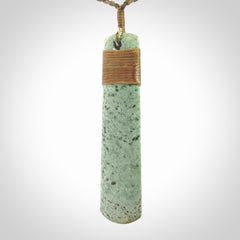 A hand carved large New Zealand Jade drop, roimata, necklace. The cord is a khaki/tan colour and is adjustable. A large sized hand made drop necklace by New Zealand artist Kerry Thompson. One off work of art to wear.