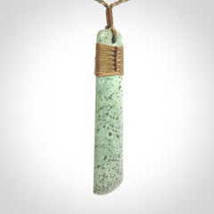 A hand carved large New Zealand Jade drop, roimata, necklace. The cord is a khaki/tan colour and is adjustable. A large sized hand made drop necklace by New Zealand artist Kerry Thompson. One off work of art to wear.