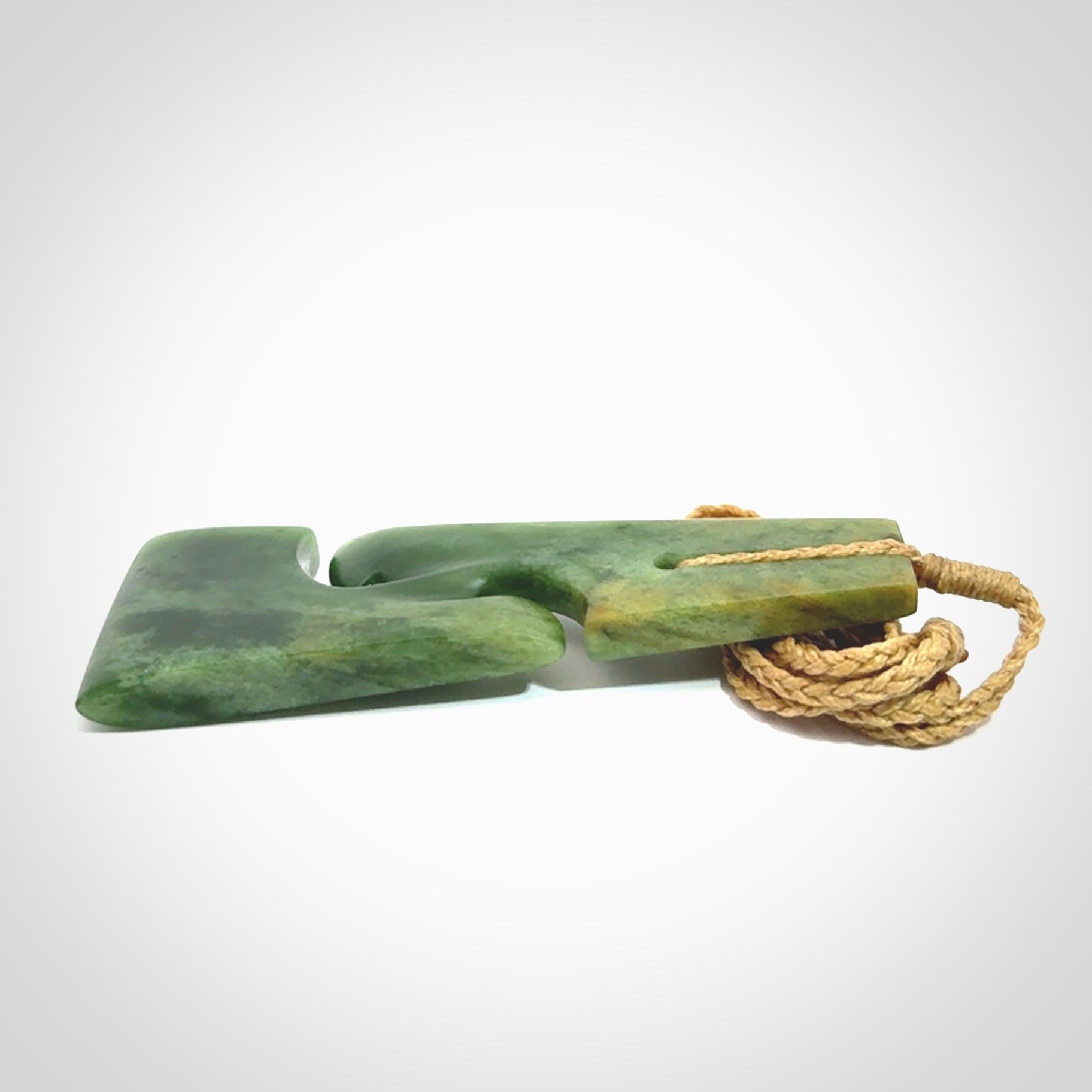 Hand made New Zealand jade toki with double koru pendant. Hand carved in New Zealand by Kerry Thompson. 