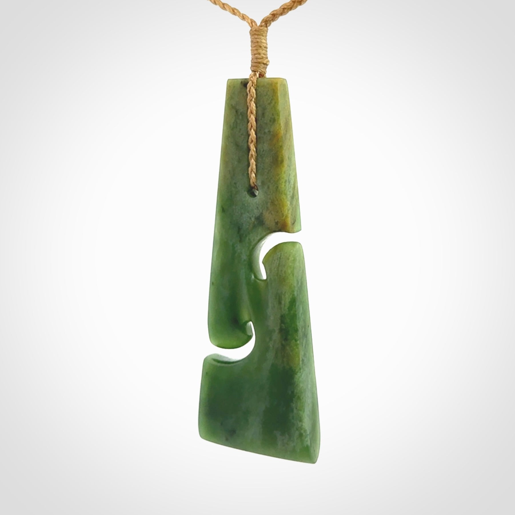 Hand made New Zealand jade toki with double koru pendant. Hand carved in New Zealand by Kerry Thompson. 