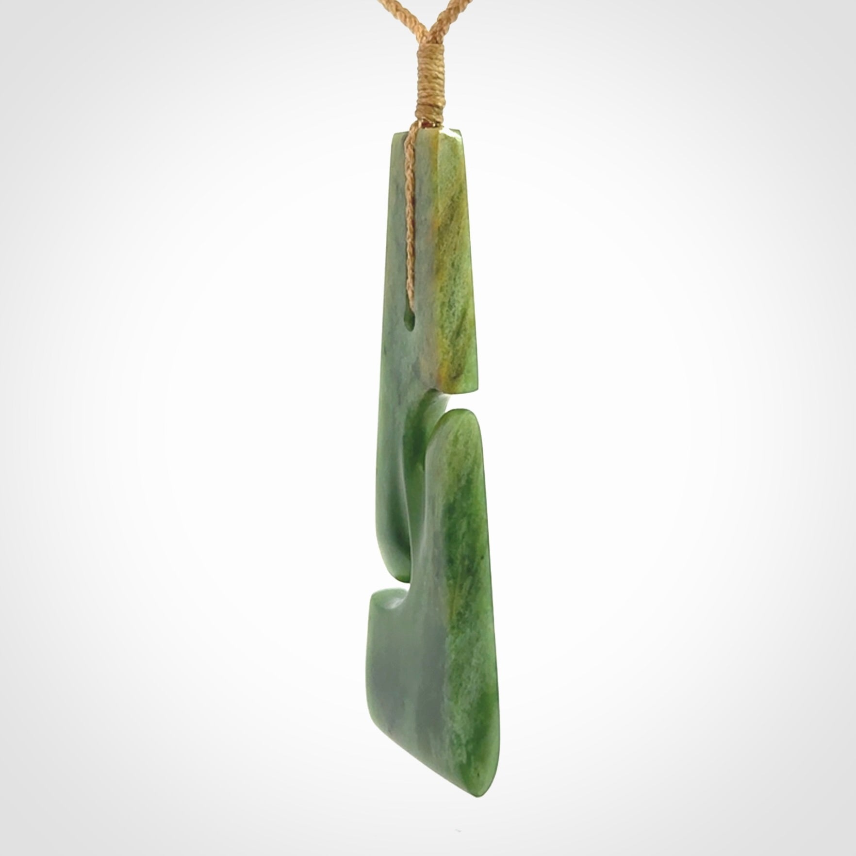 Hand made New Zealand jade toki with double koru pendant. Hand carved in New Zealand by Kerry Thompson. 