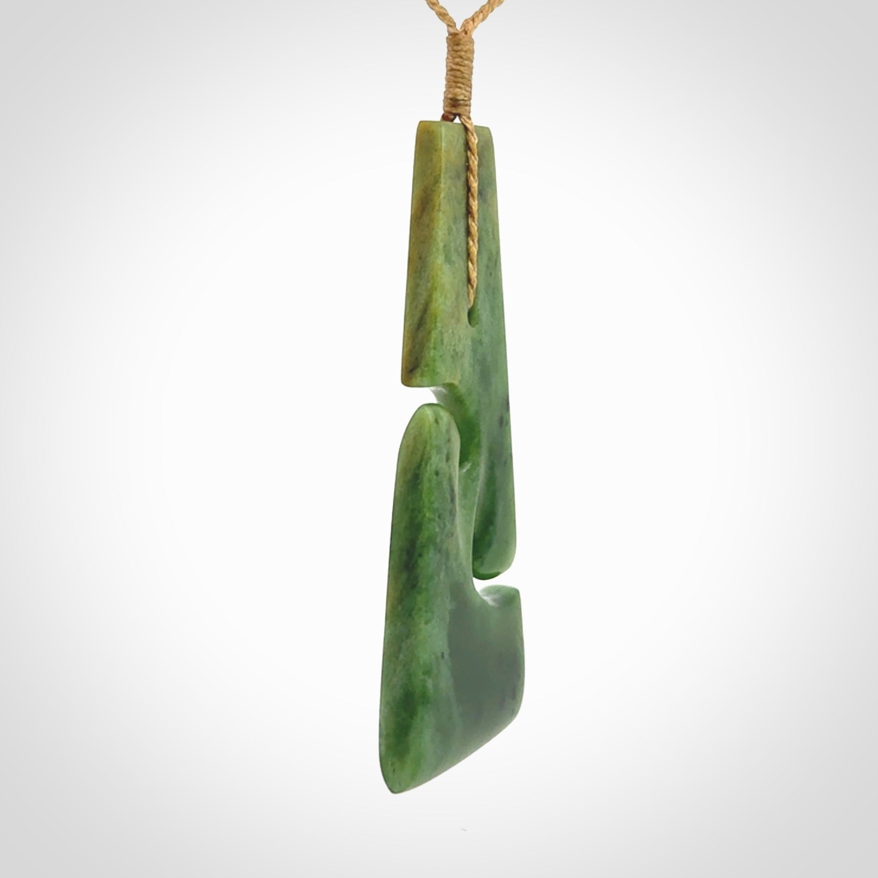 Hand made New Zealand jade toki with double koru pendant. Hand carved in New Zealand by Kerry Thompson. 