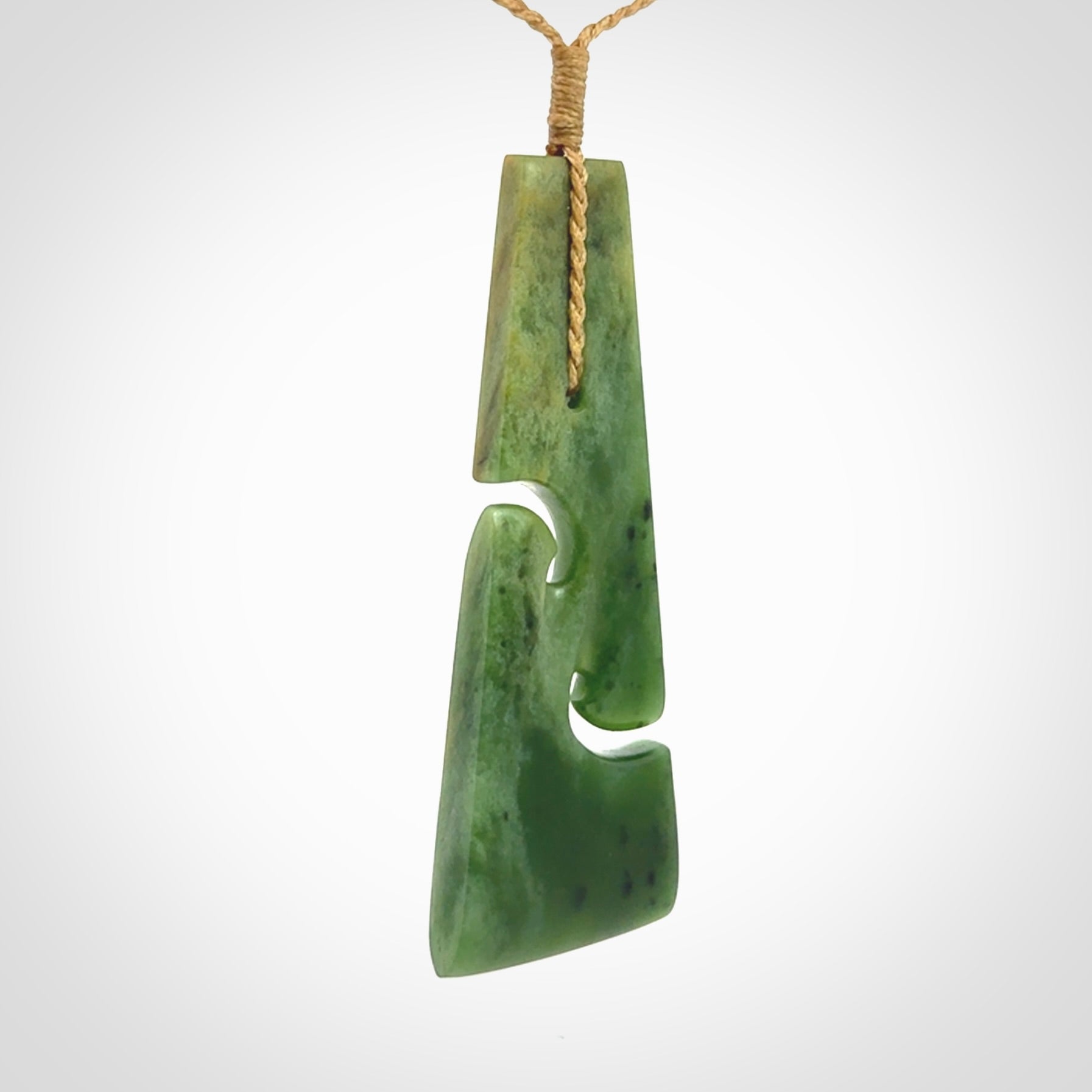 Hand made New Zealand jade toki with double koru pendant. Hand carved in New Zealand by Kerry Thompson. 