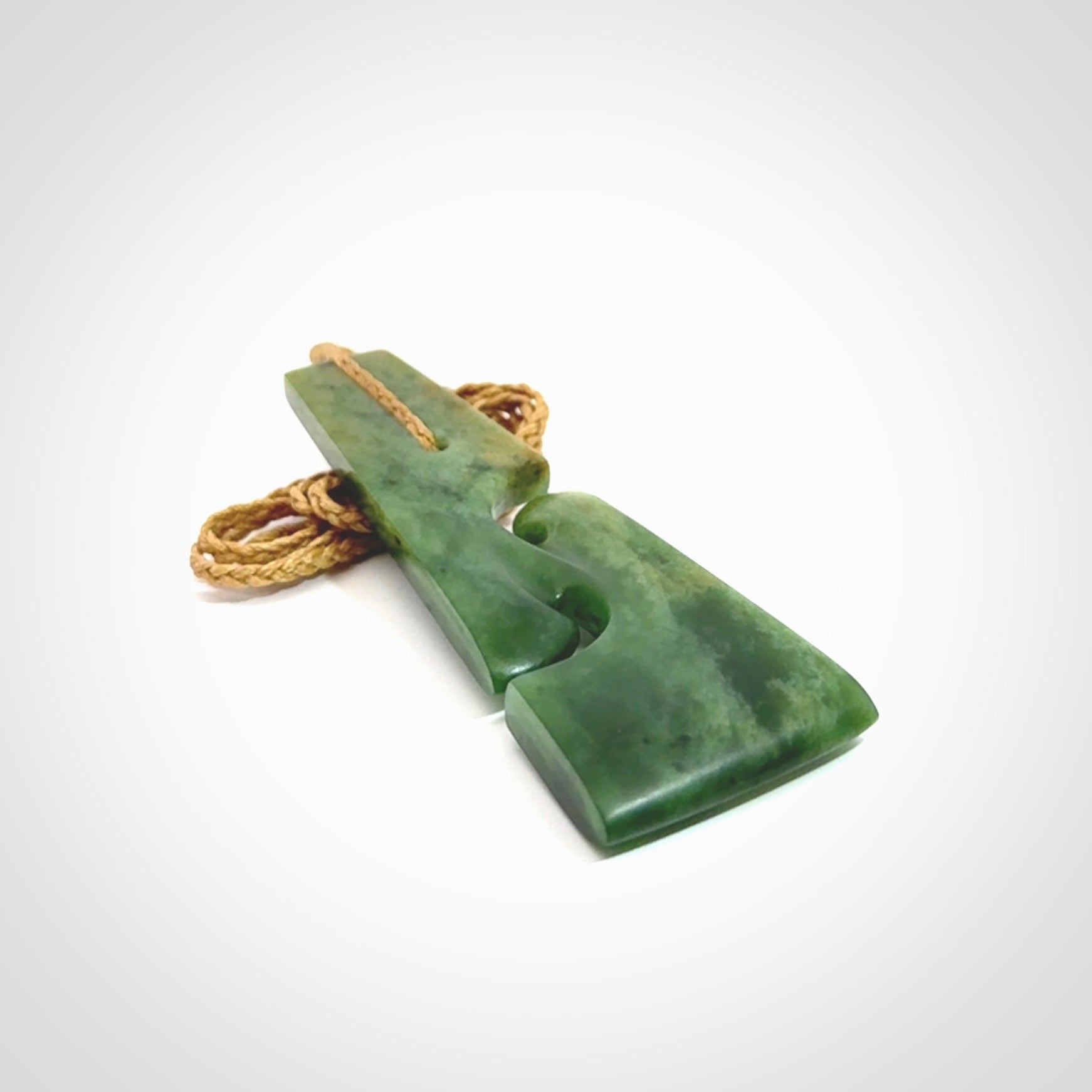 Hand made New Zealand jade toki with double koru pendant. Hand carved in New Zealand by Kerry Thompson. 