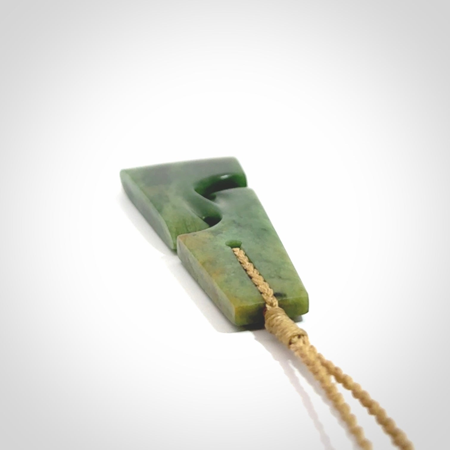 Hand made New Zealand jade toki with double koru pendant. Hand carved in New Zealand by Kerry Thompson. 