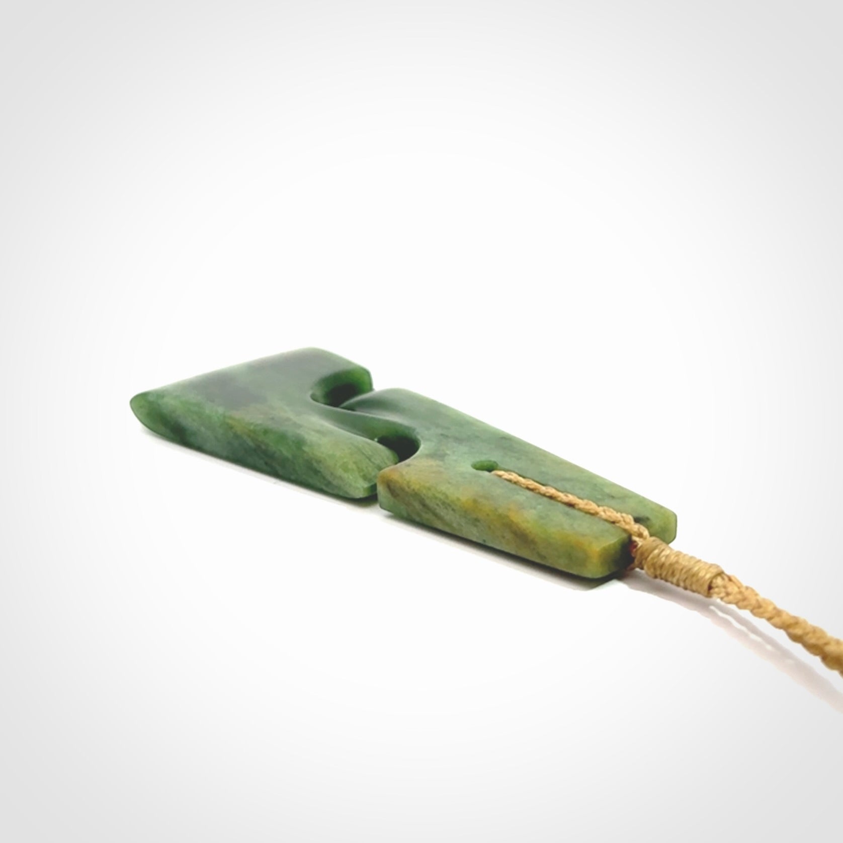 Hand made New Zealand jade toki with double koru pendant. Hand carved in New Zealand by Kerry Thompson. 