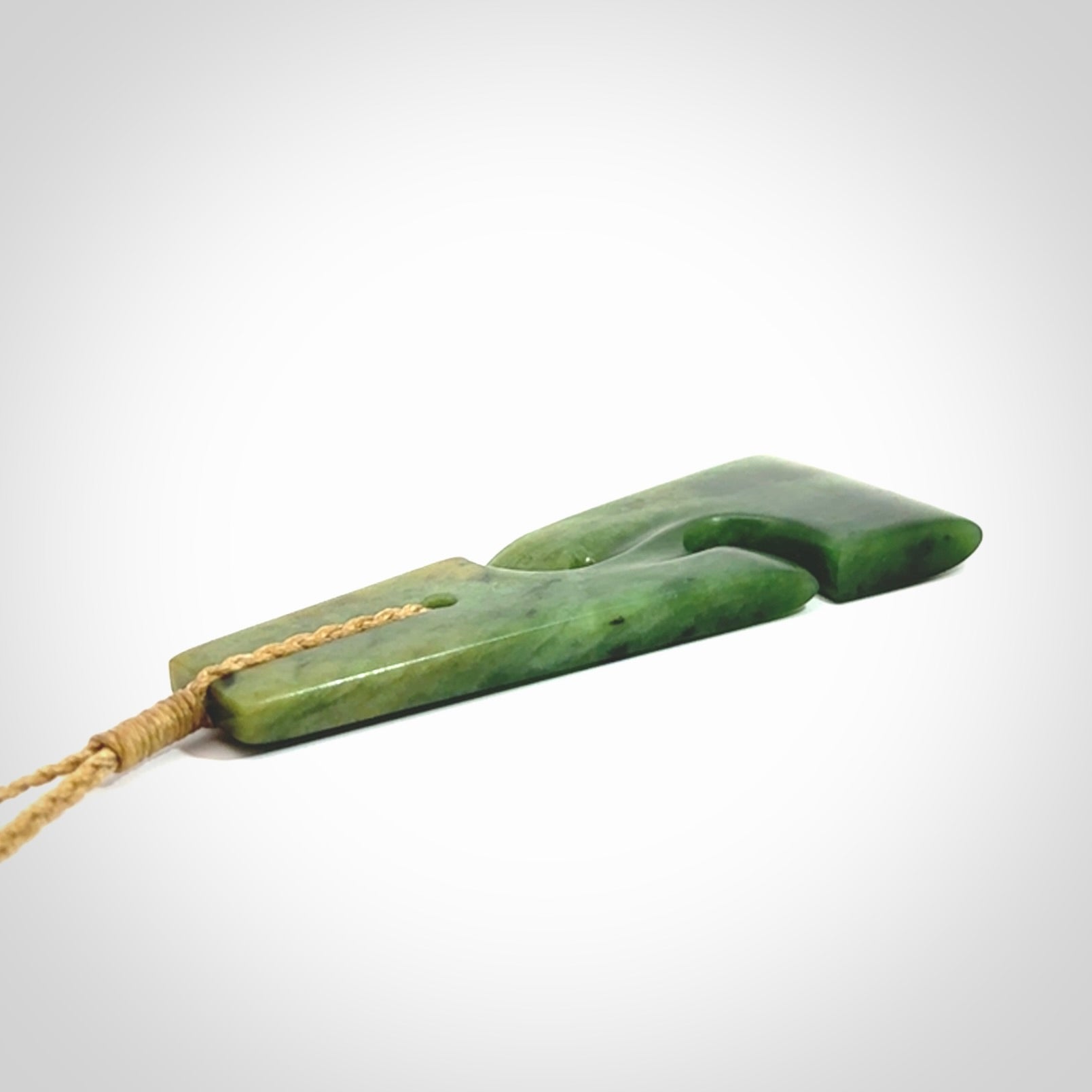 Hand made New Zealand jade toki with double koru pendant. Hand carved in New Zealand by Kerry Thompson. 