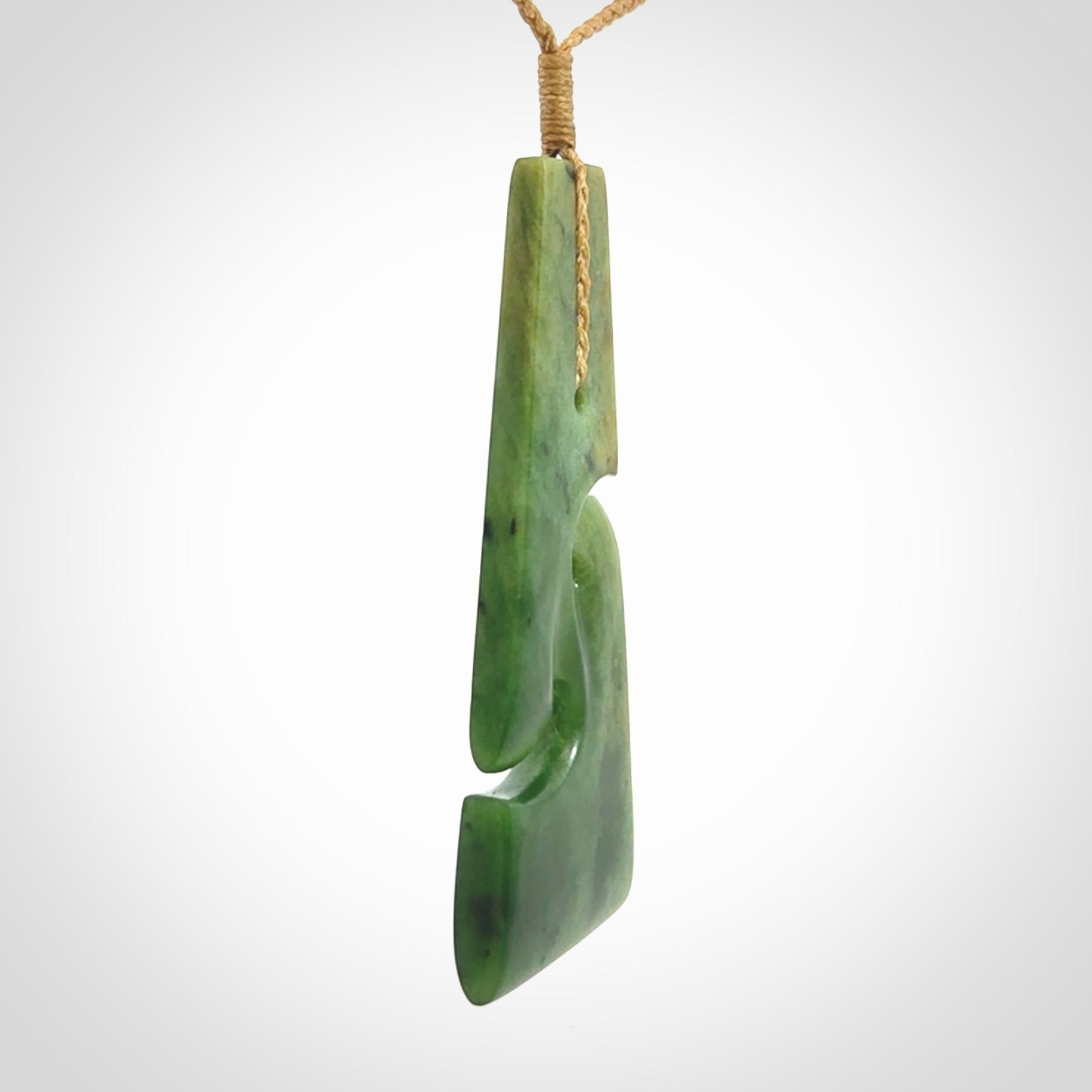 Hand made New Zealand jade toki with double koru pendant. Hand carved in New Zealand by Kerry Thompson. 