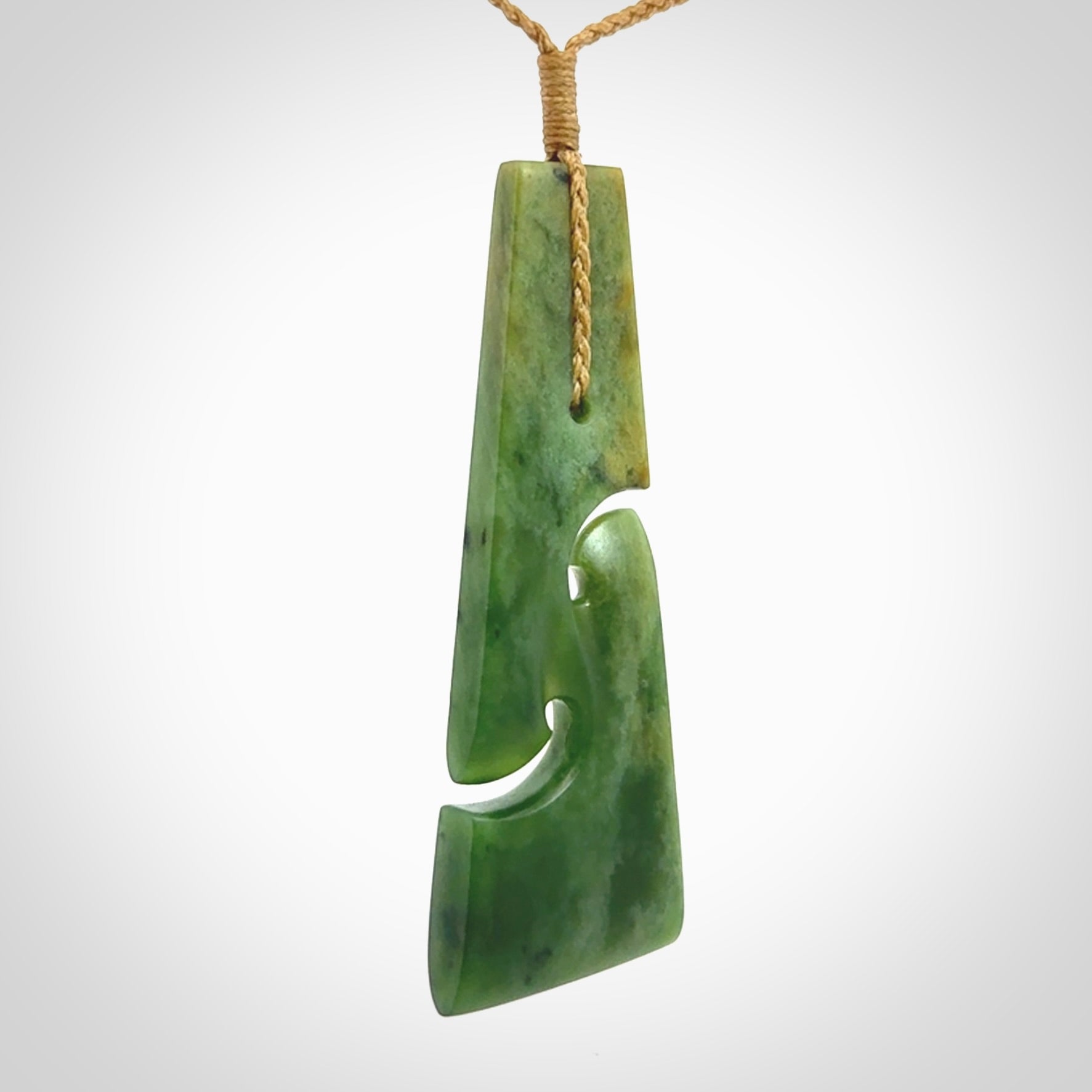 Hand made New Zealand jade toki with double koru pendant. Hand carved in New Zealand by Kerry Thompson. 