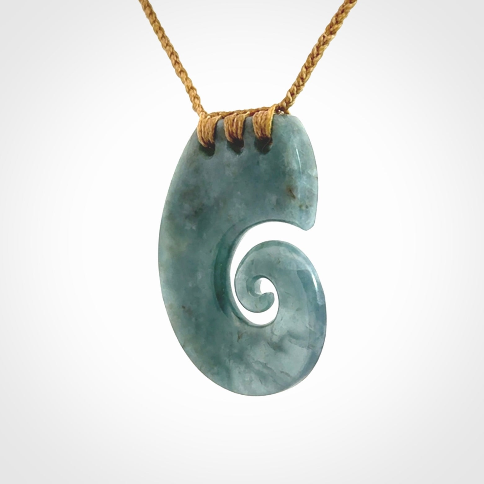 Hand carved Guatemalan Jade koru pendant.
