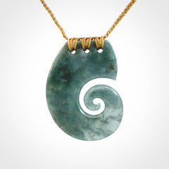 Hand carved Guatemalan Jade koru pendant.