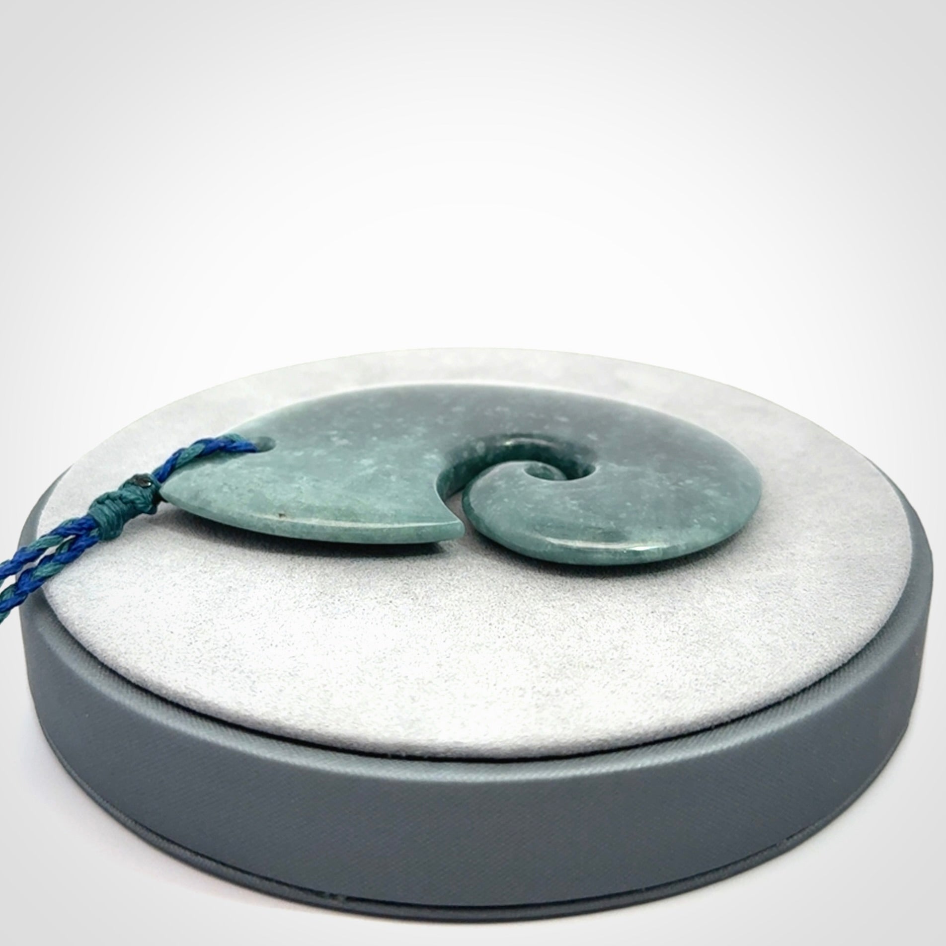 Hand carved Guatemalan Jade koru pendant.