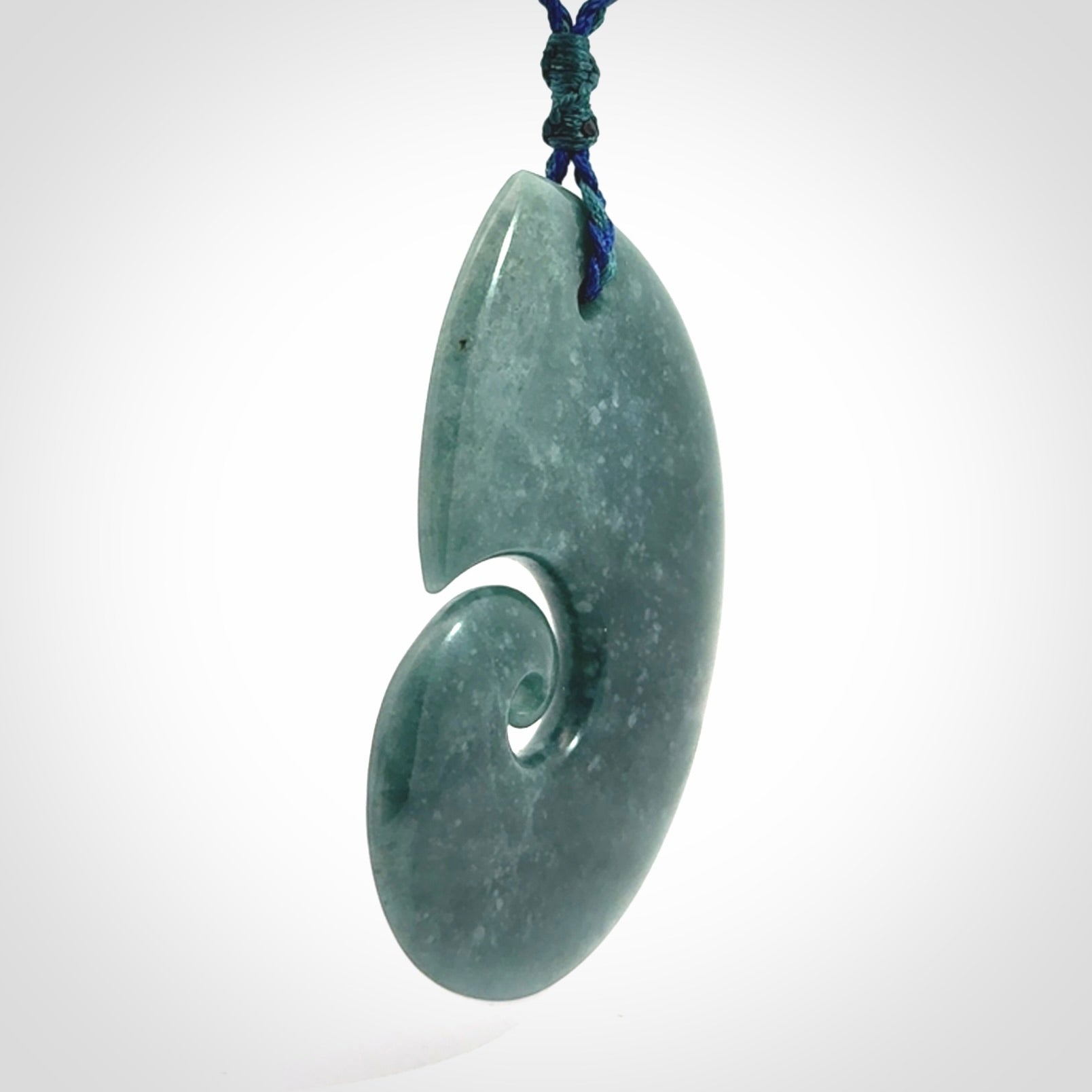 Hand carved Guatemalan Jade koru pendant.