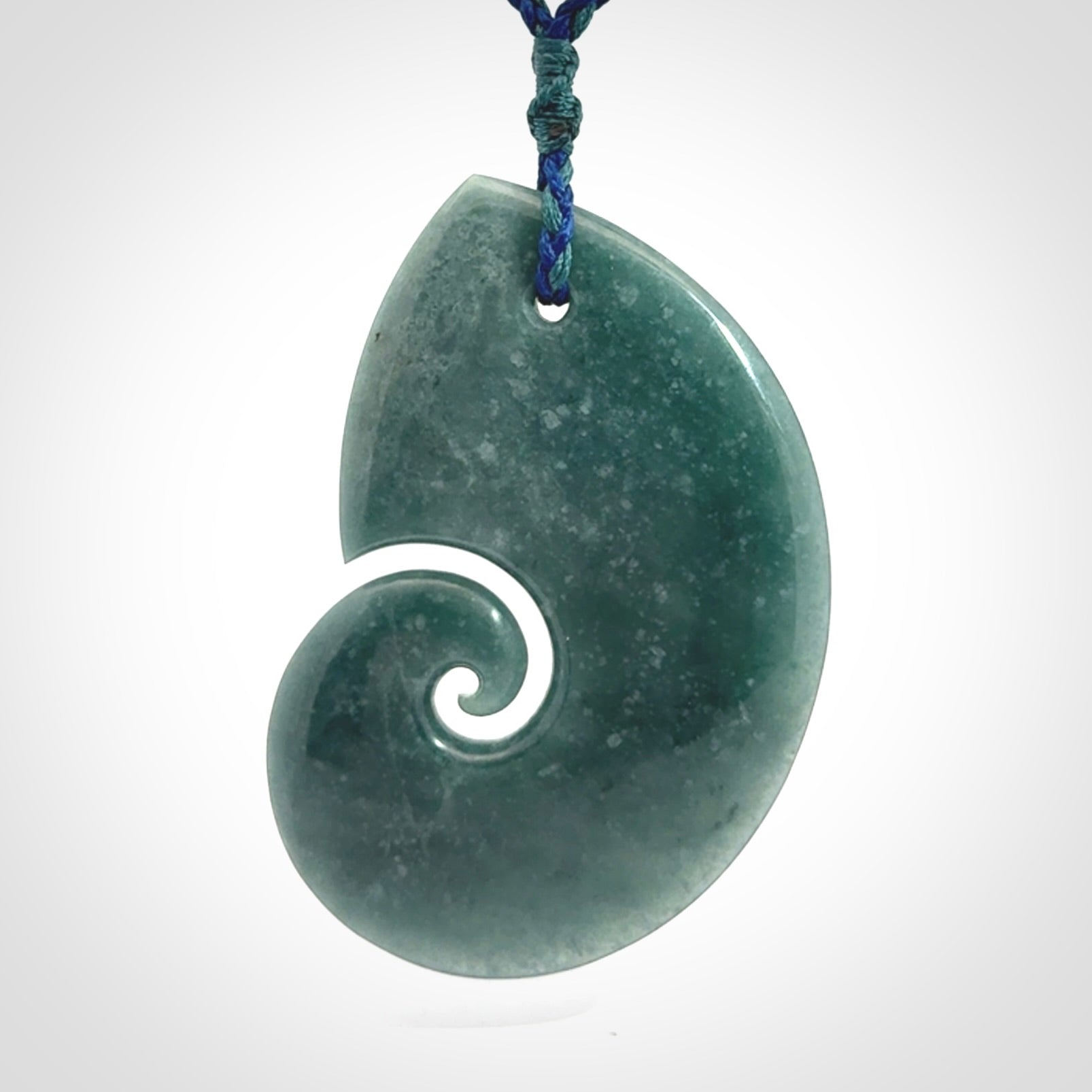Hand carved Guatemalan Jade koru pendant.